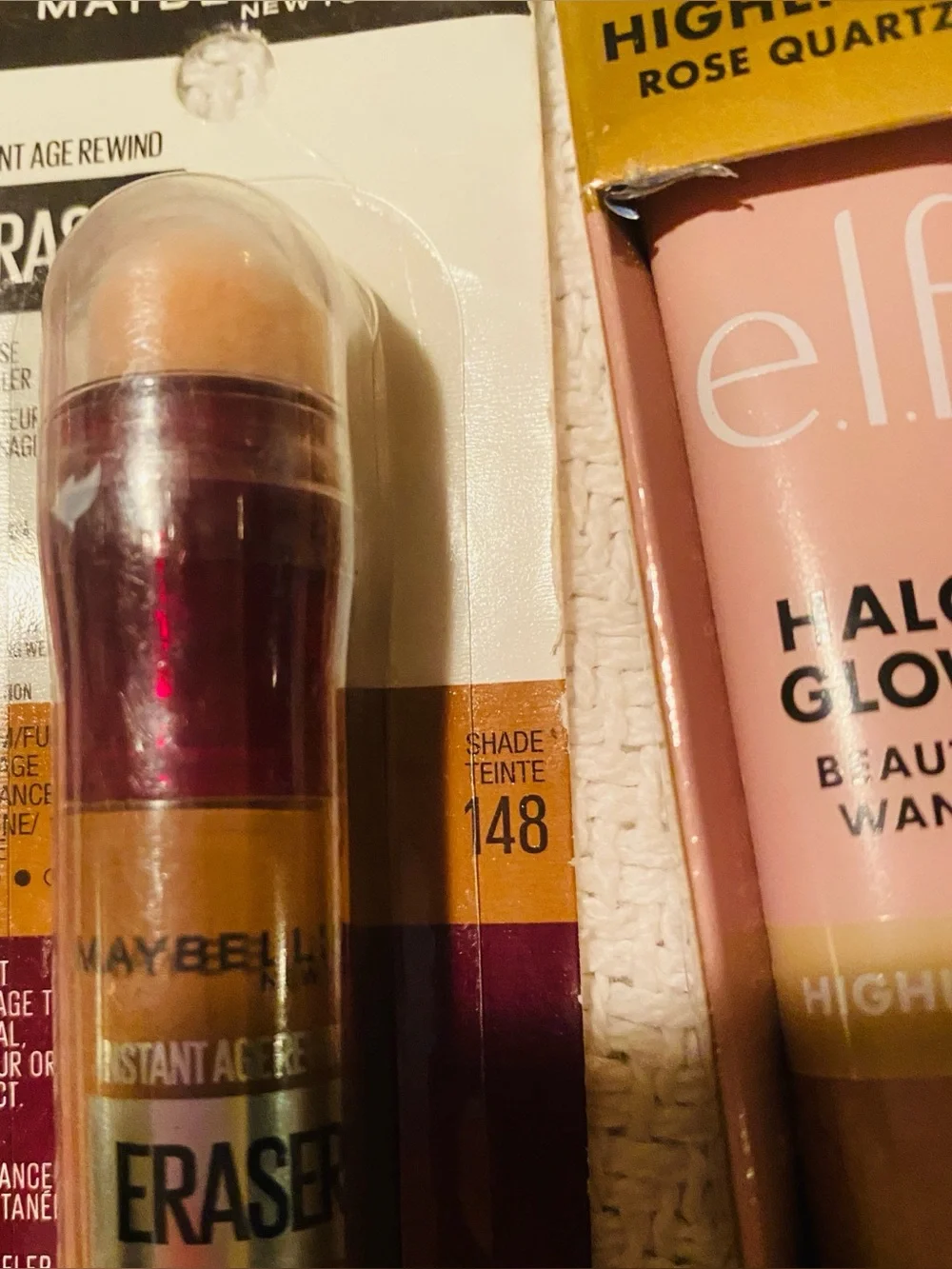Bundle of Maybelline makeup assortment of earrings, skin care, nail polish